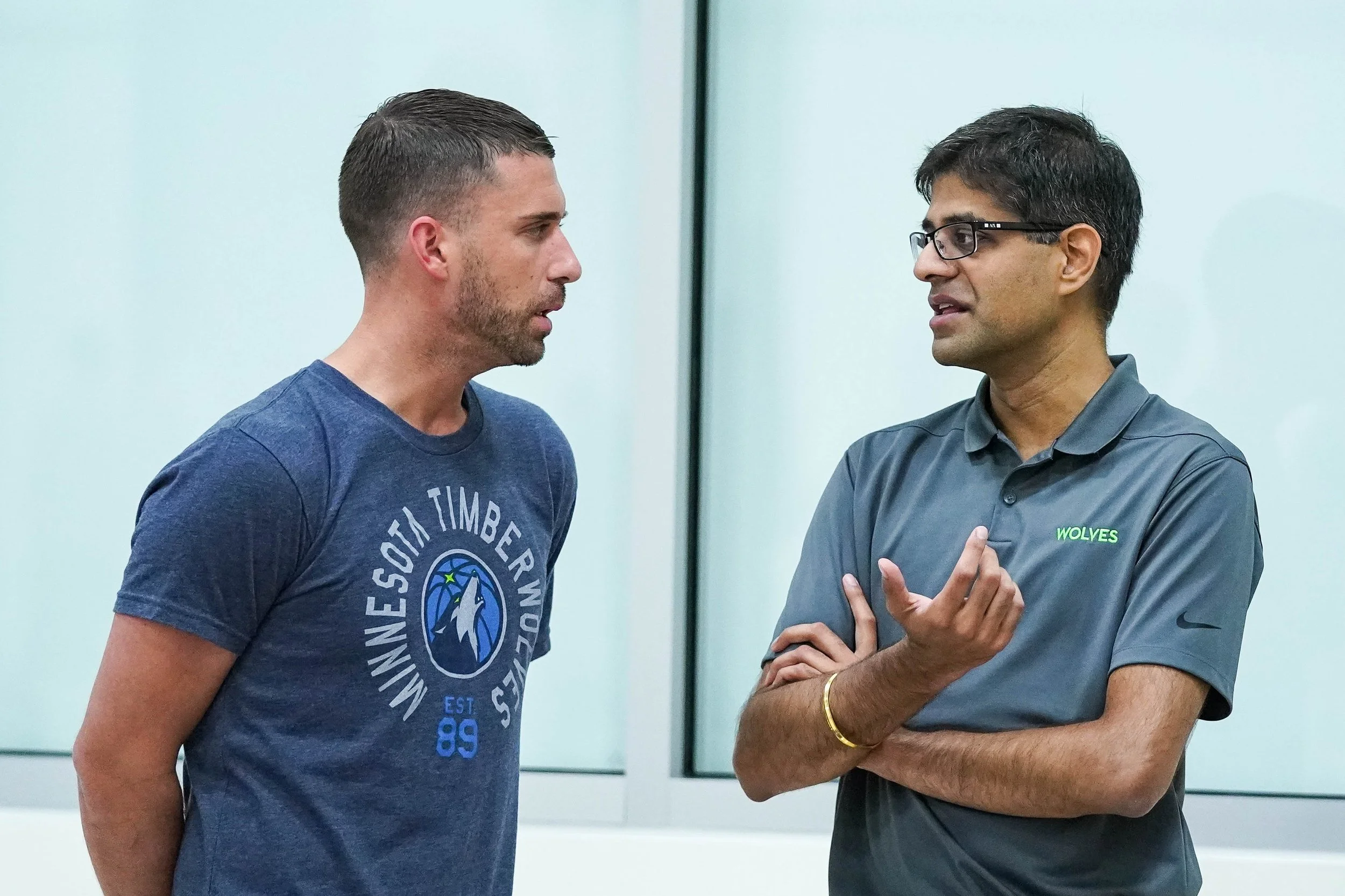 Founder Robby Sikka talking with an athlete