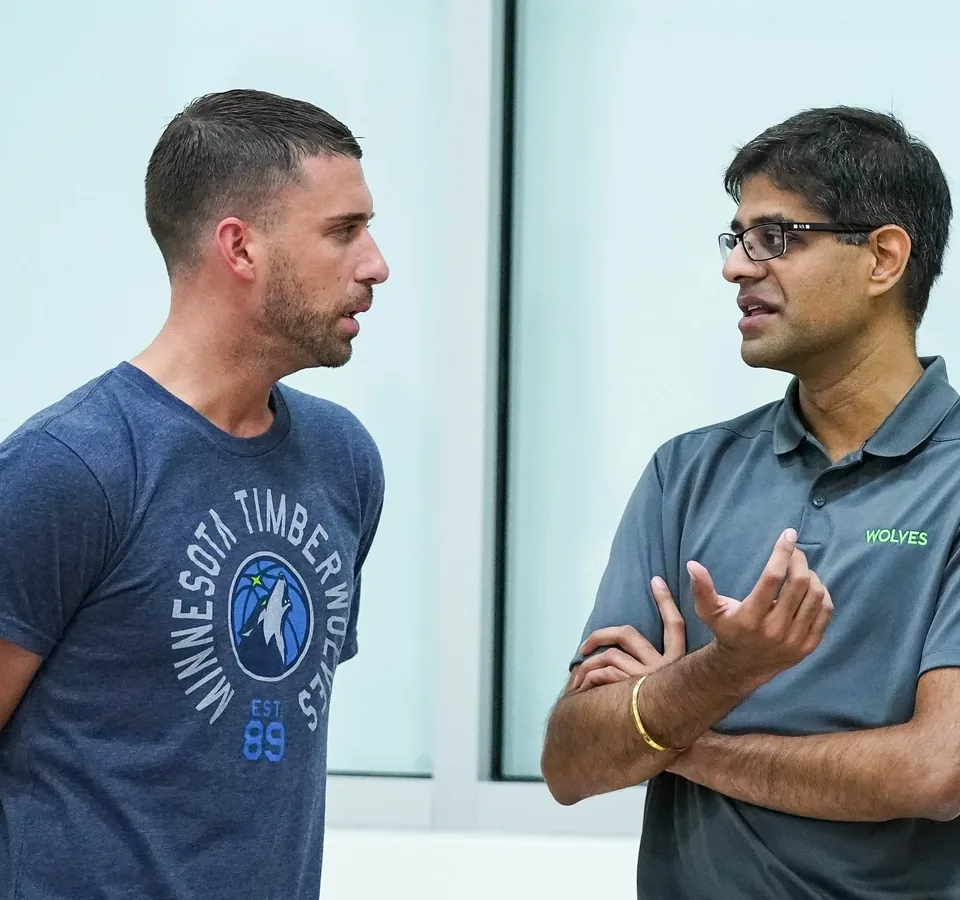 Founder Robby Sikka talking with an athlete